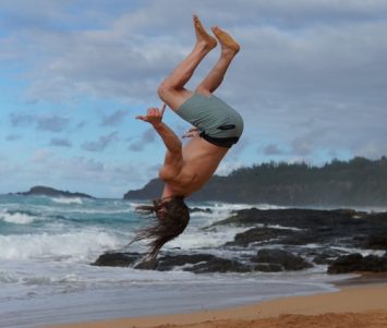 man doing a backflip in Maui Hawaii