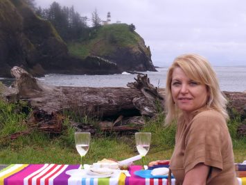 Darcy Waits a Woman sitting on a picnic blanket at Cape Disappointment