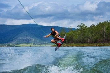 a wakeboarder wearing a wakeboarding life vest