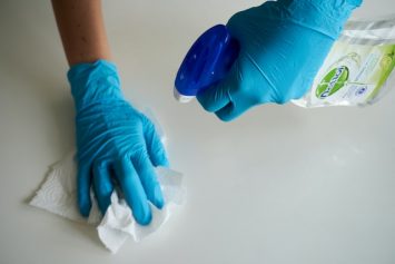 Hands scrubbing with Cleaning Products