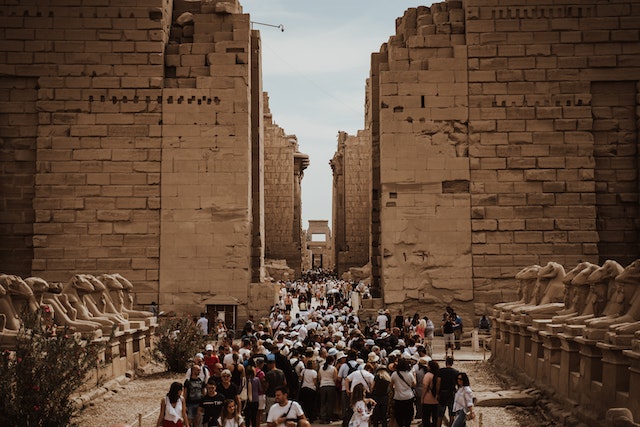 Tourists visiting the Karnak temple in Egypt Caption: Luxor is a must-see when you're visiting Egypt.
