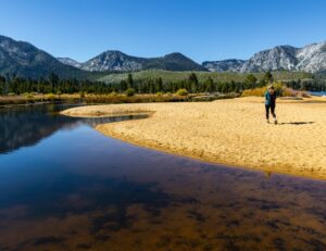 Female Hiker on The Sandy Shore of Kiva Beach, Lake Tahoe