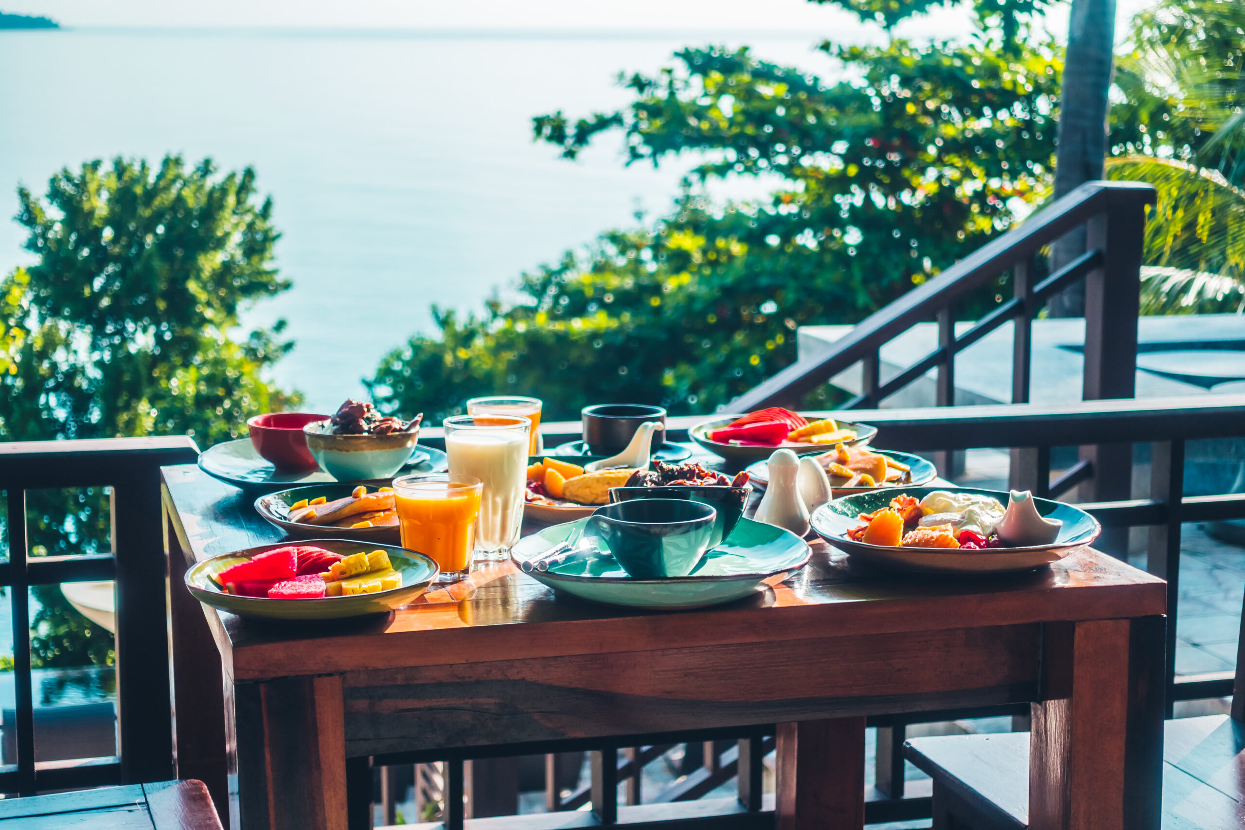 healthy-breakfast-set-with-egg-bacon-pancakes-orange-juice-milk-bread-coffee