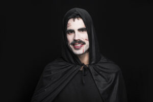 young-smiling-man-posing-black-halloween