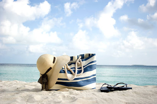A Cute Handbags sitting on the beach ready to be Used for Summer
