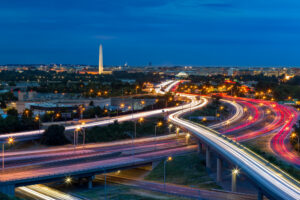 Washington D.C. cityscape at dusk with rush hour traffic
