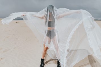 A woman hiding under a Mosquito net