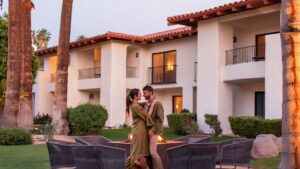 Couple in front of tommy bahama miramonte hotel