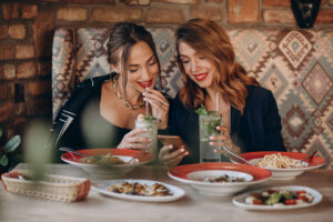 two women eating in restaurant