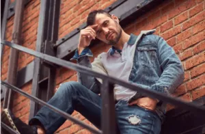 A guy posing in his denims