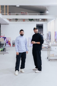 Two men standing and posing