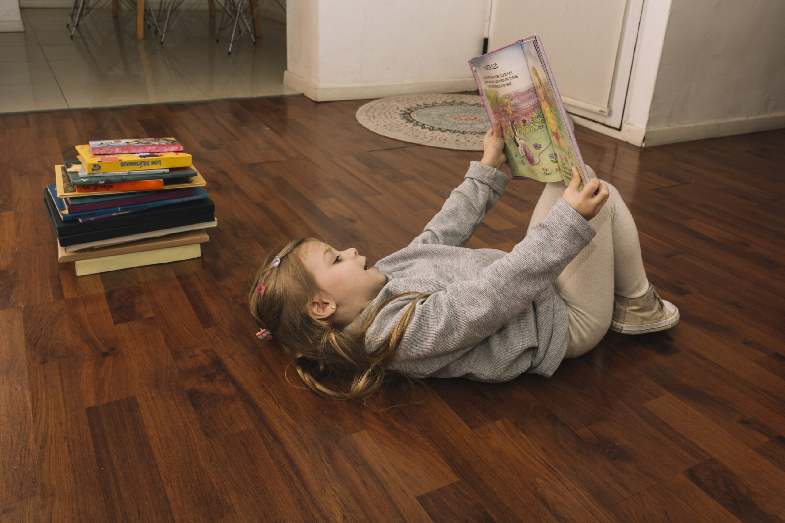 Kid lying on the laminate floor